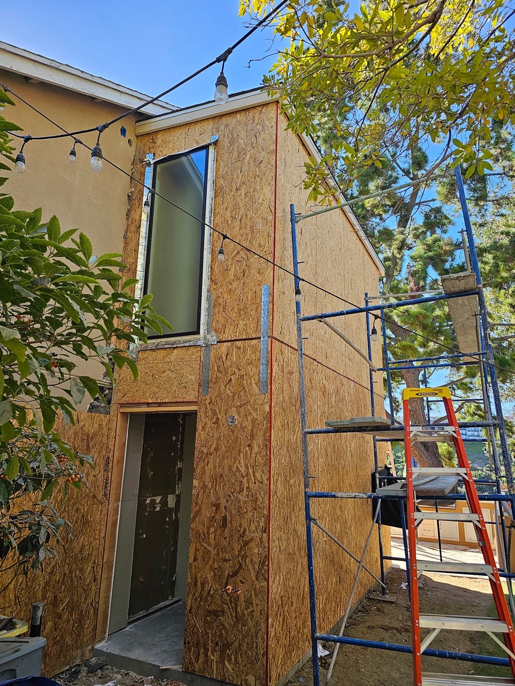 ADU under construction at sheathing stage with scaffolding