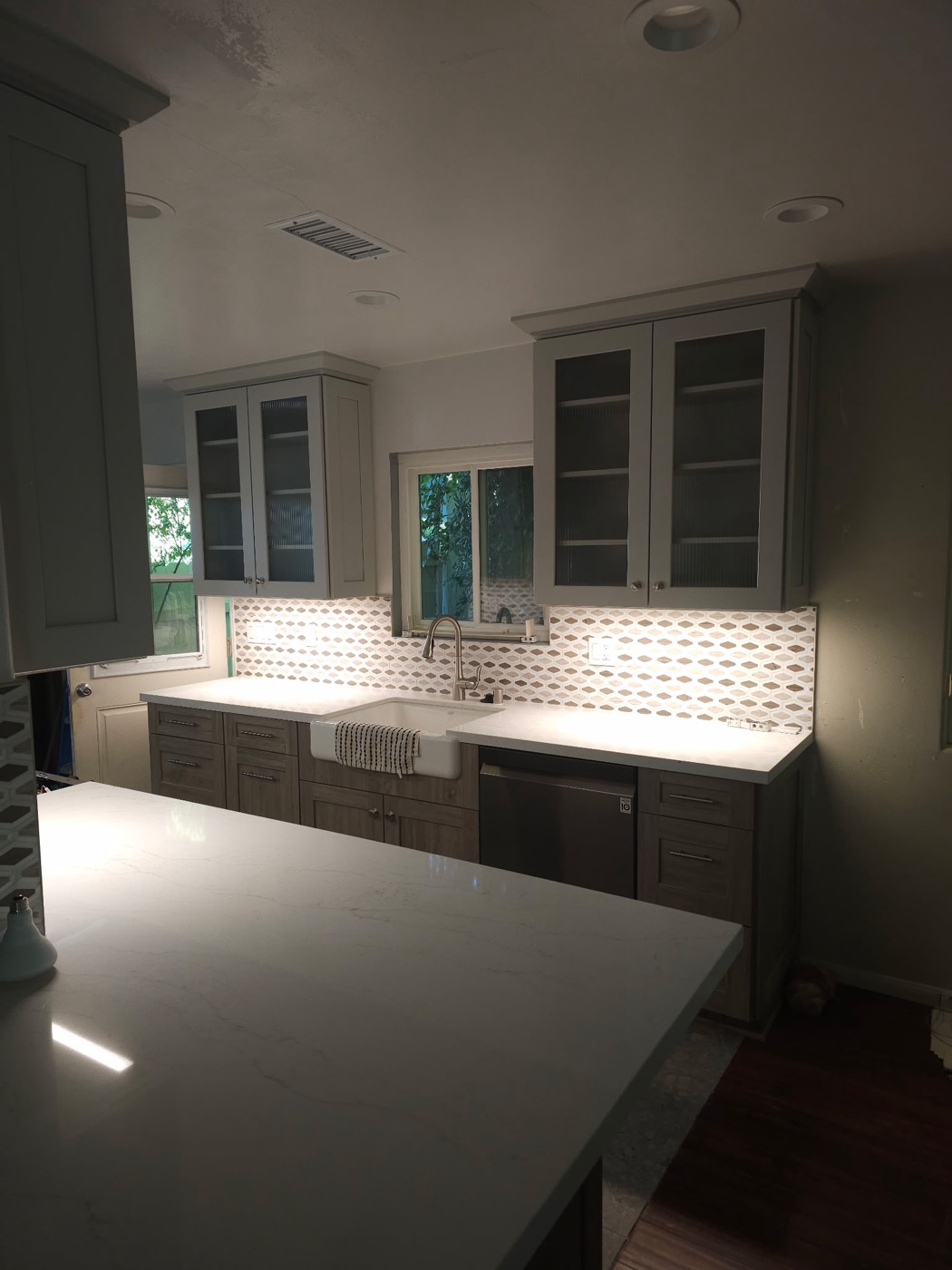 Kitchen remodel with under-cabinet lighting and farmhouse sink