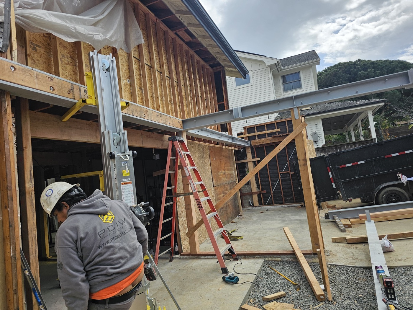 Framing crew working on room addition structure