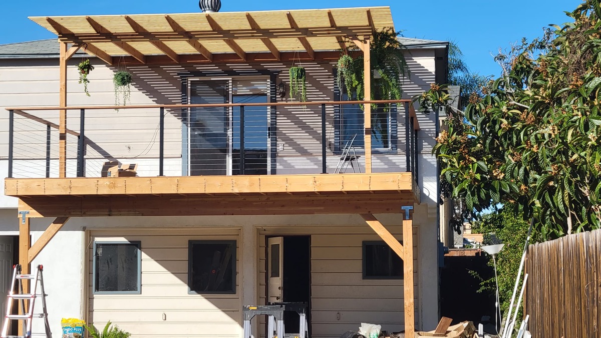 Second-story deck and pergola addition under construction