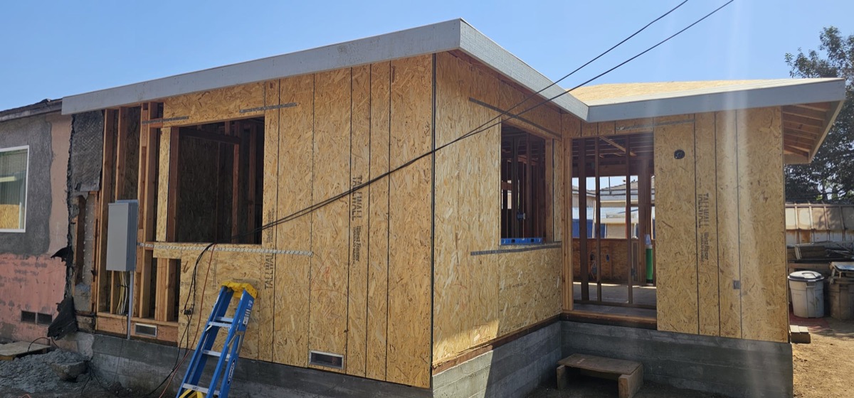 ADU framing with OSB sheathing and newly installed windows