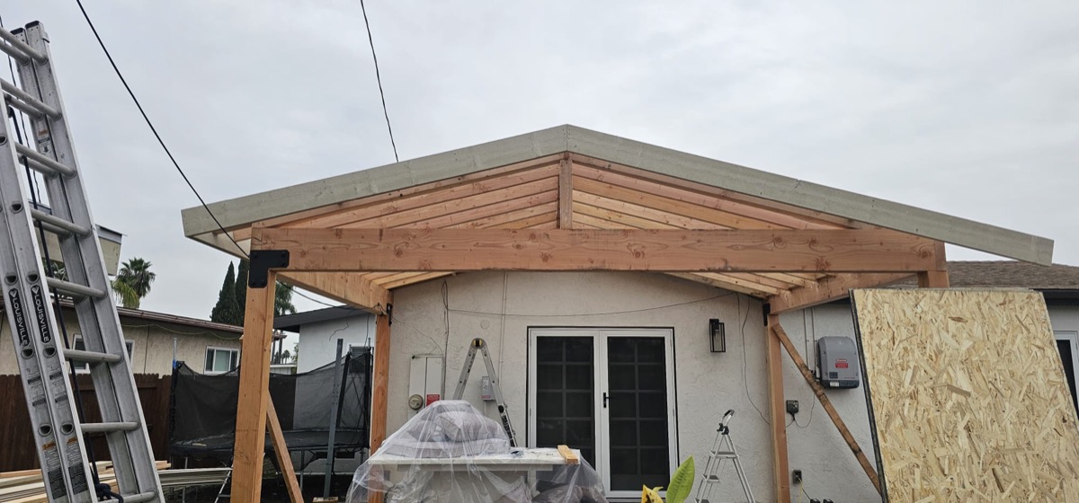 Home addition with covered pergola and new gabled roof
