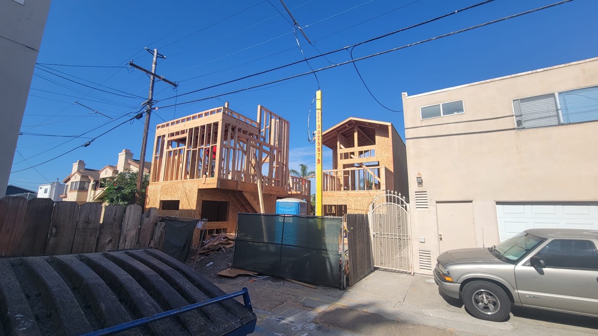 Multi-unit new build framing viewed from street